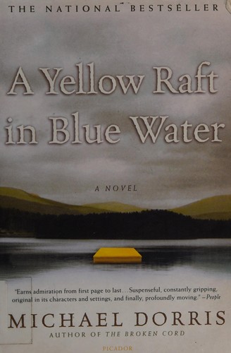 A yellow raft in blue water 